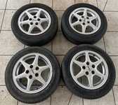 Alu kolo TITAN 6x14" ET37, 5x100x57 a 2ks Saetta Touring 2 185/60 R14 82H 30% a 2ks Hankook K715 Optimo 185/60 R14 82T 30%